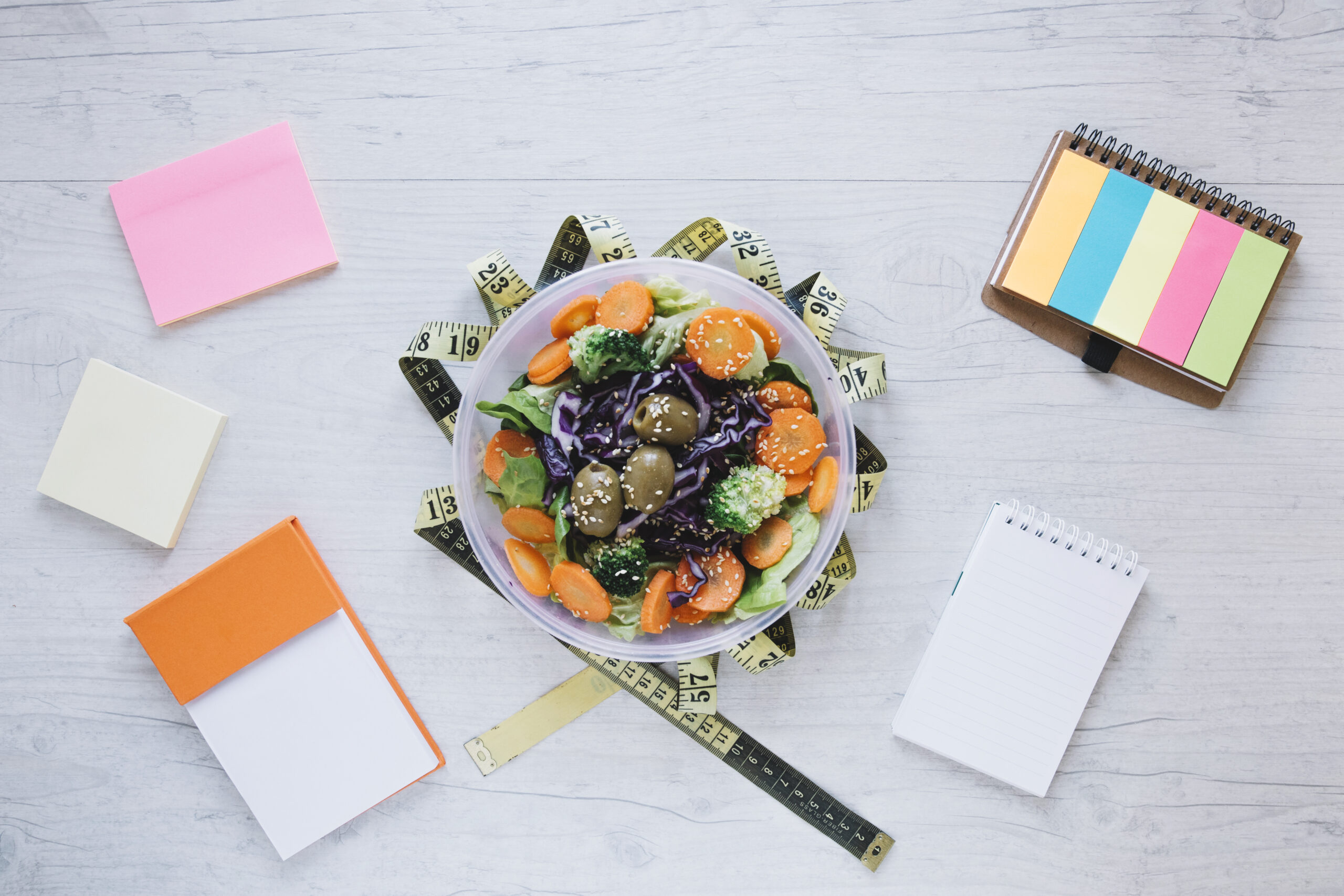 Healthy office snack ideas including fruits, nuts, yogurt, and veggie sticks arranged neatly for work-friendly snacking.